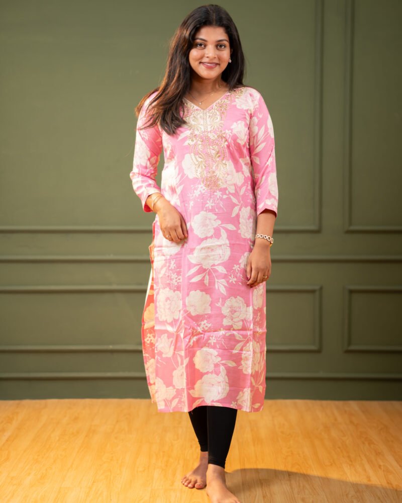 Women’s blush pink floral kurti with a straight fit design, featuring soft fabric and elegant prints, suitable for casual and office wear.